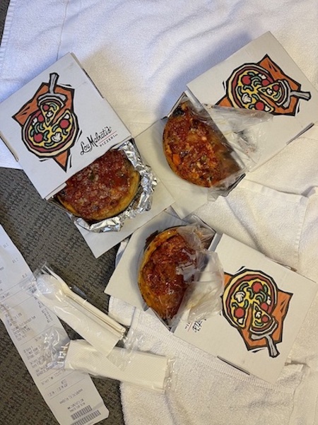 Three deep dish pizzas